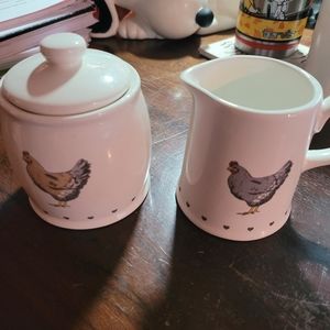 Sugar and creamer set with hen and rooster.